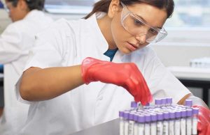 Lab Technician Checking Tube Labels