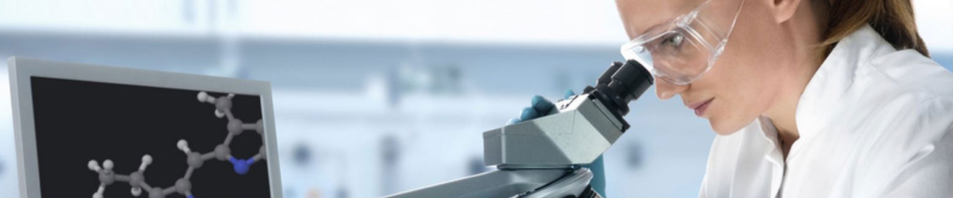Lab Technician Using Microscope